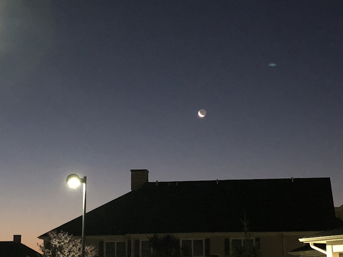 Moon over apartment building
